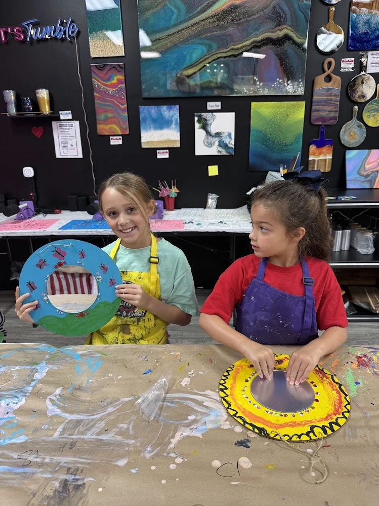 Students creating advanced Dutch pour paint canvas art