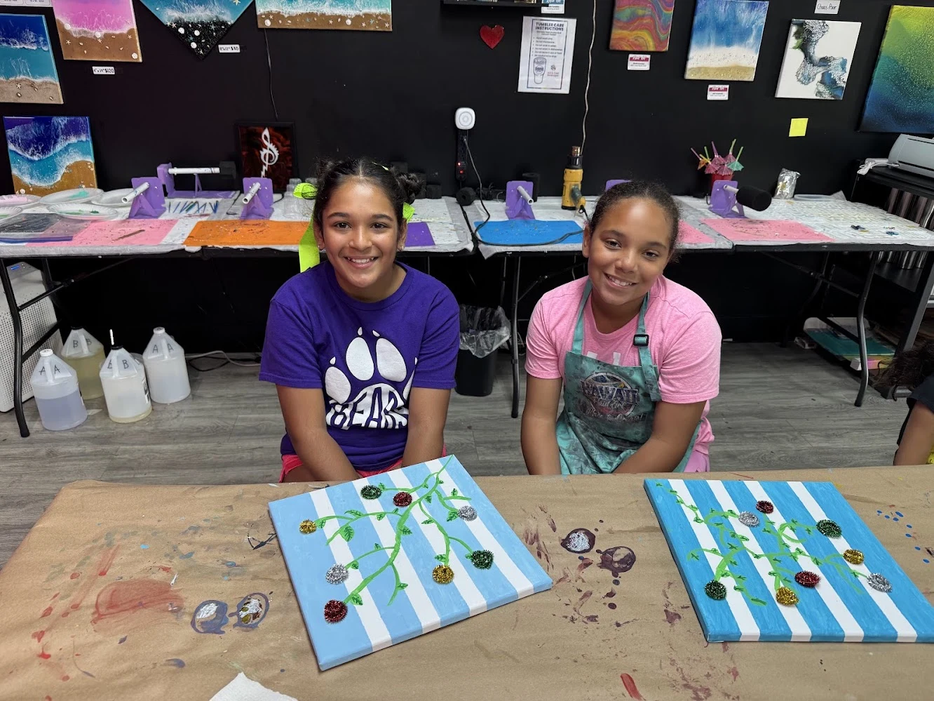 Students completing full year art exhibition projects in after school program