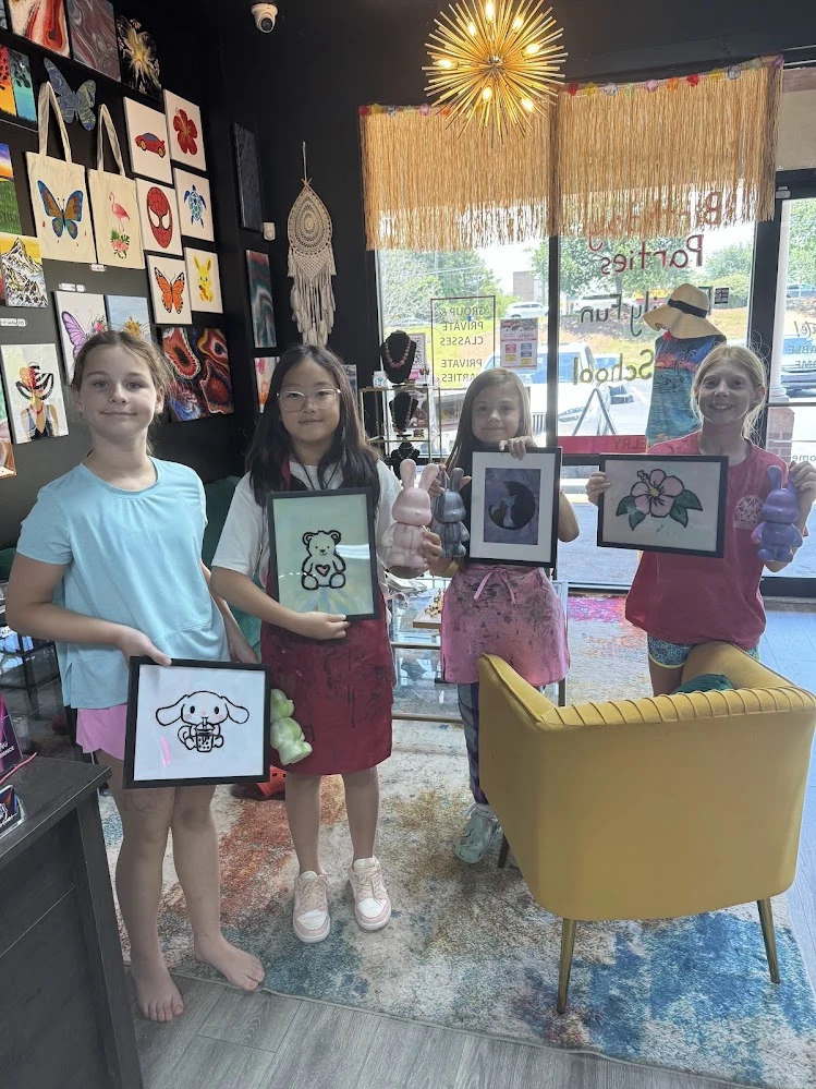 Master Studio ages 10-12+ working on advanced fluid art resin tumblers and canvas art
