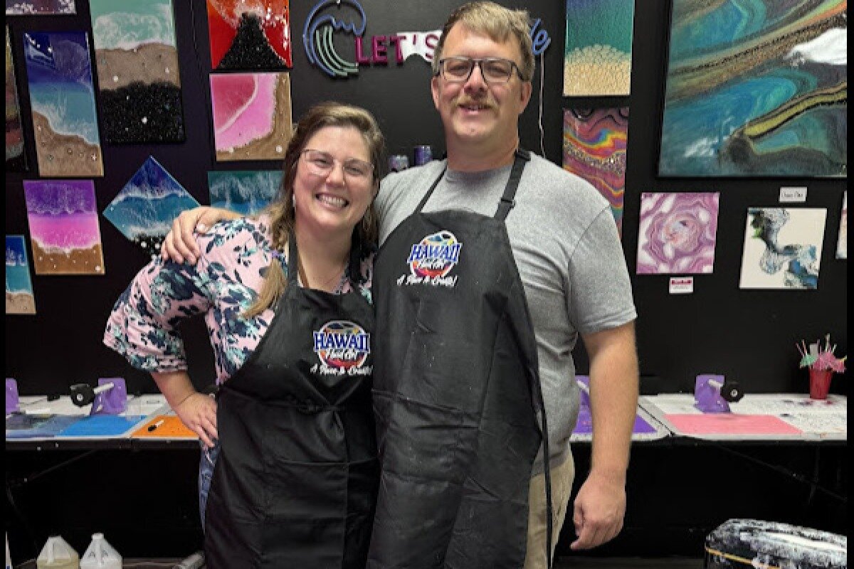 Couple celebrating handmade gifts at Hawaii Fluid Art studio