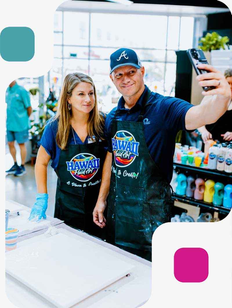 Couple creating art together at date night painting class at Hawaii Fluid Art