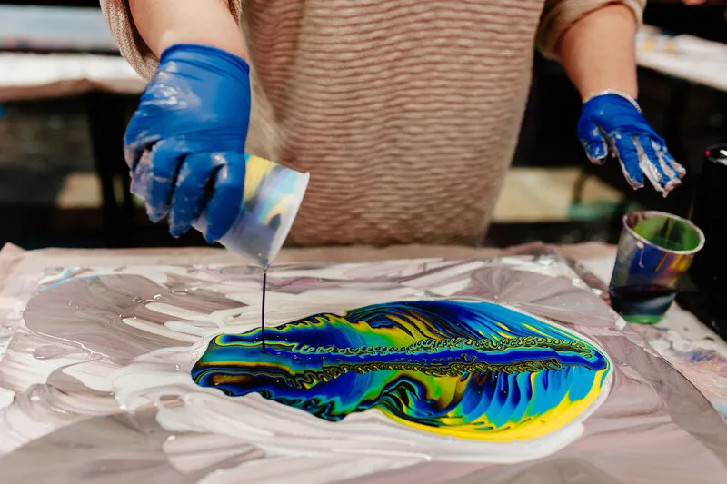 Beautiful custom fluid art canvases displayed at Hawaii Fluid Art Johns Creek