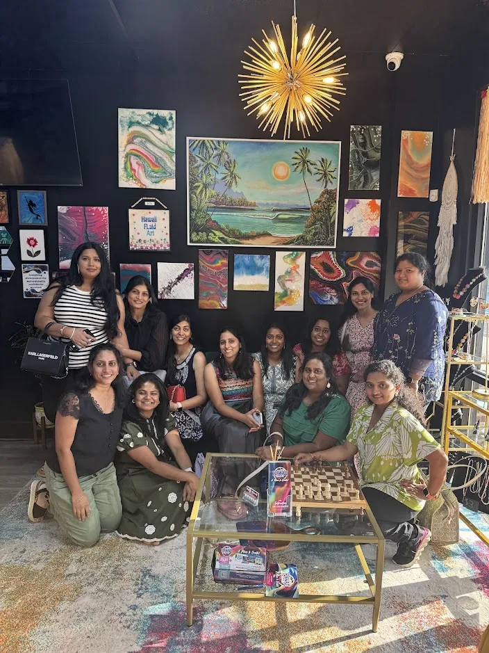 Squad celebrating a bachelorette party with wine and painting