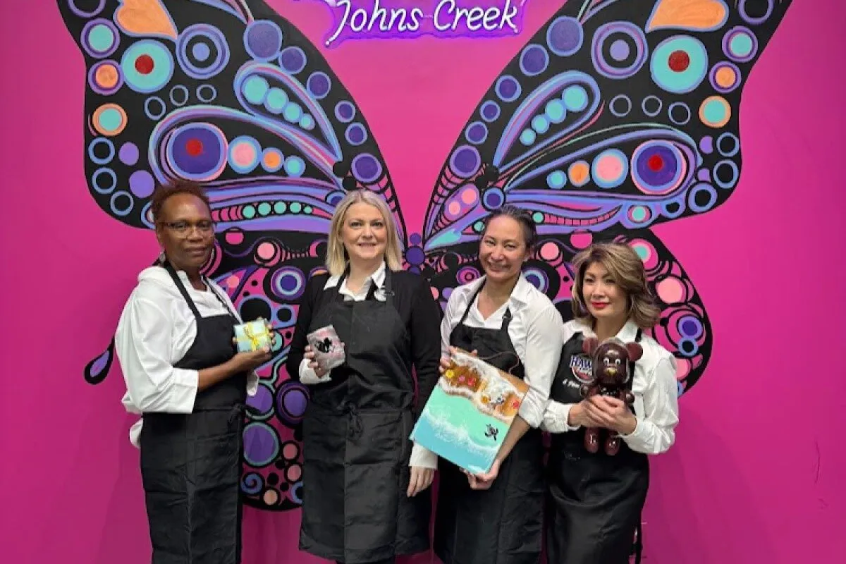 Bachelorette group displaying their custom fluid art masterpieces