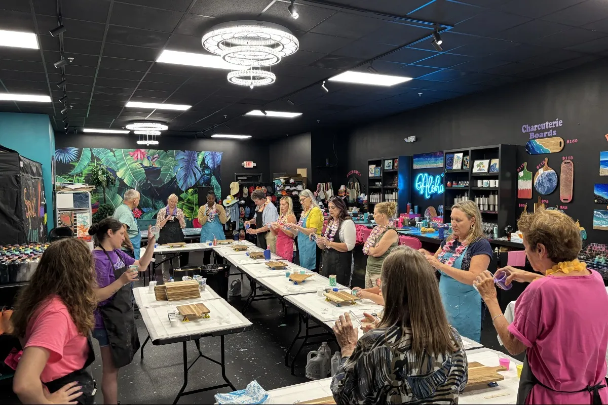 Friends and family celebrating a baby shower at Hawaii Fluid Art in Johns Creek