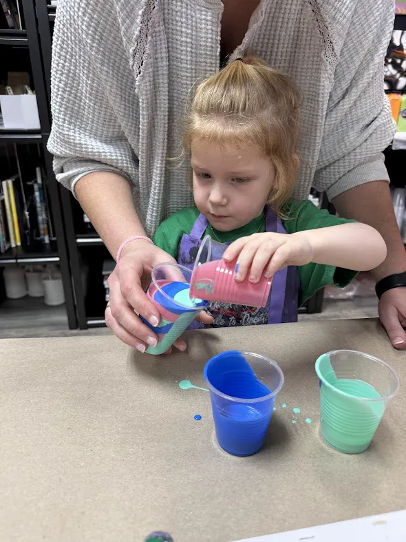 Homeschool students learning foundational fluid art techniques