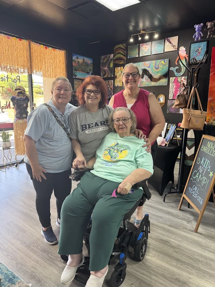 Ladies gathering and socializing during a private kitty party art session at Hawaii Fluid Art